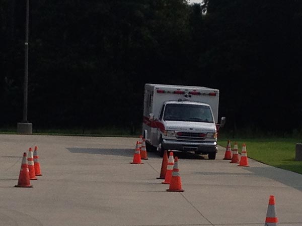 Ambulance driving through a course of cones